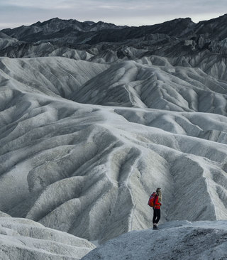Traveler Standing on Mountain