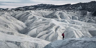 Traveler Standing on Mountain
